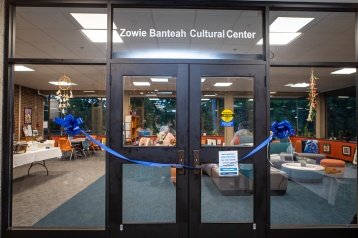The doors to the Zowie Banteah Cultural Center, adorned with a blue ribbon to mark the grand opening of the new location