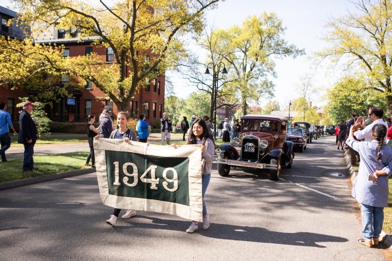 The class of 1949 riding in antique cars during the 2019 Laurel Parade