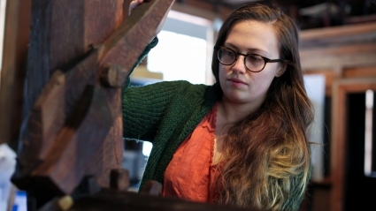 Erin Hancock with the barn-frame loom she rebuilt.