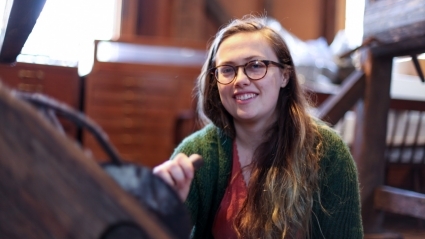 Erin Hancock ’20 with the 200-year-old barn-frame loom she rebuilt.