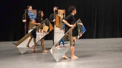 Four student performers hold full-length mirrors in front of themselves as they rehearse Joan Jonas ’58’s “Mirror Piece I & II: Reconfigured (1969/2018-2019)” under the guidance of the artist.