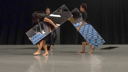 Three student performers hold full-length mirrors in front of themselves as they rehearse Joan Jonas ’58’s “Mirror Piece I & II: Reconfigured (1969/2018-2019)” under the guidance of the artist.