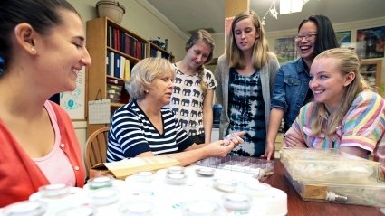 Darby Dyar, Kennedy-Schelkunoff Professor of Astronomy, working with students in her lab