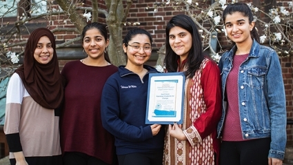 Members of Kuch Karo: Pakistani Students For Change, pose with their Distinguished Student Organization Award.