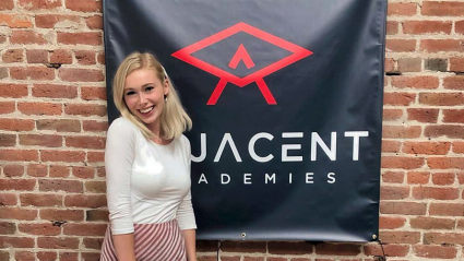 Emma Wolff ’21 near the sign for Adjacent Academies’ Summer of Code in 2020
