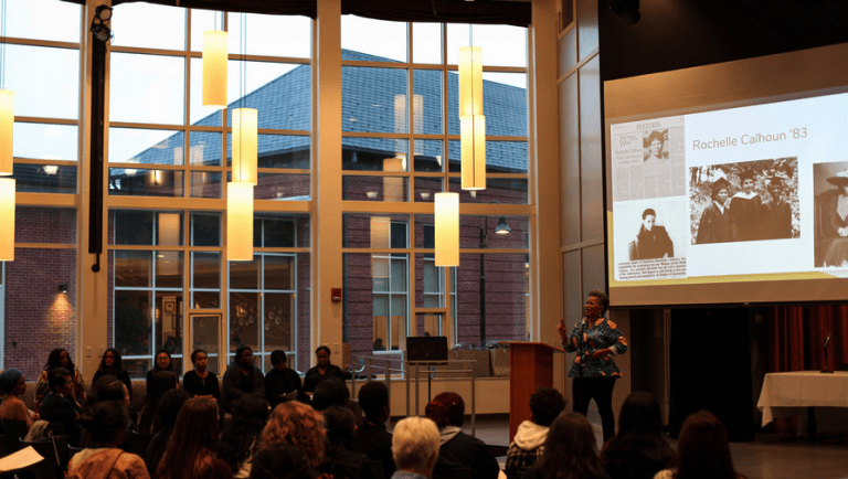 Rochelle Calhoun speaking on stage at the Hortense Parker Celebration in 2019.