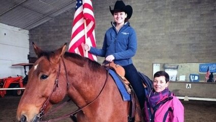 Sabrina Fox ’18, shown with her mother Anne Fox, rides the horse Viktor during the national anthem