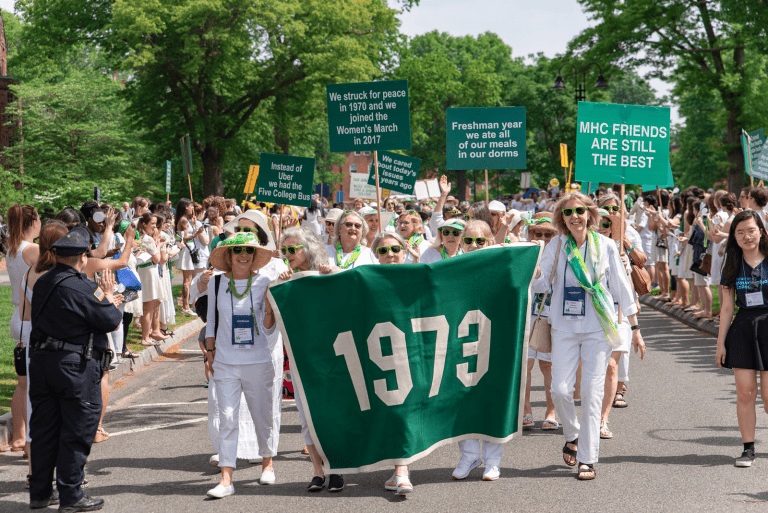 The class of 1973 marching with their class banner in the Laurel Parade