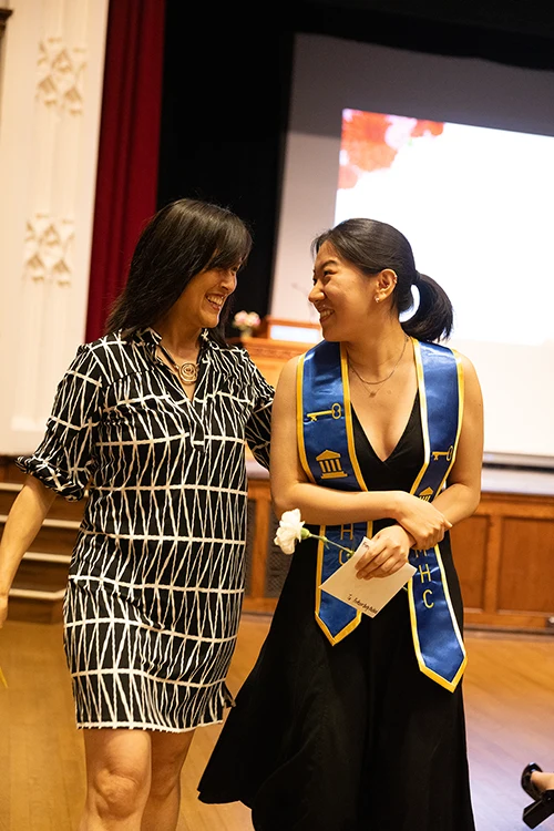 Mentor and mentee share smiles during the Stoling Ceremony at Mount Holyoke College