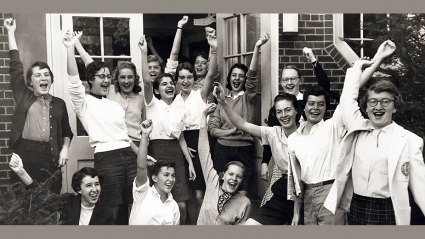 Students cheer with raised hands on Mountain Day, circa 1955.