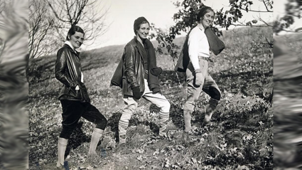 Three students hiking up the hill on Mountain Day 1930.