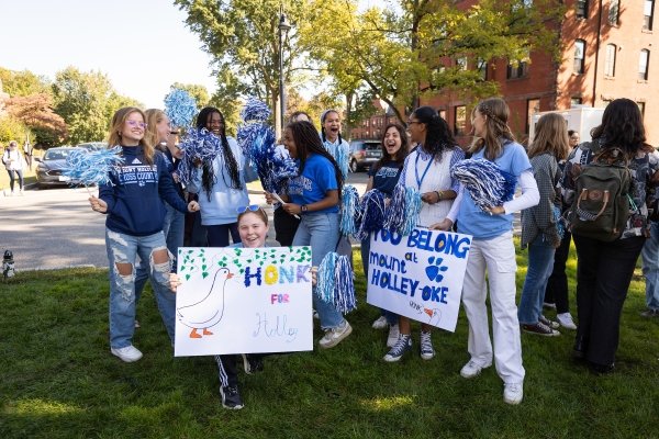 Students with signs on Pageant Green in support of Danielle R. Holley during her investiture.