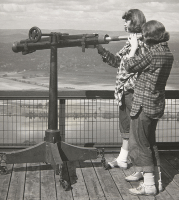 Students looking through a telescope atop Mount Holyoke in 1947
