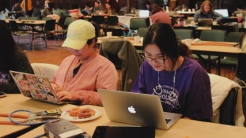 HackHolyoke 2019: Kiki Wang ’21 (left) and Wenyun Wang ’20 working on their game about the periodic table of elements.