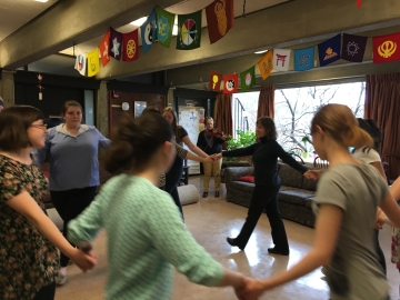 Students folk dancing in the Eliot House lounge
