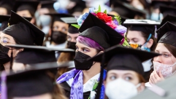 Yvaine Neyhard FP ’20 wore a mortarboard decorated with silk flowers to Commencement 2020
