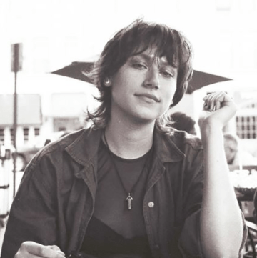 Carmen Mickelson seated at an outdoor table