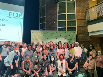  group of students and staff at the Fearless First reception during Orientation