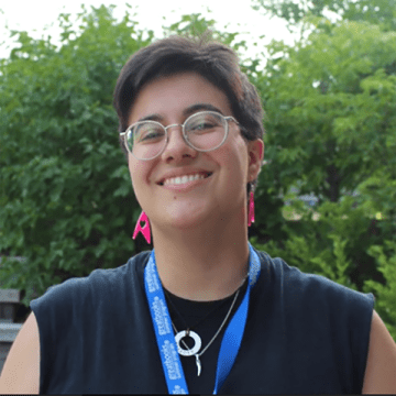 Gina Pasciuto standing outside with trees in the background