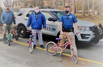 Public Safety officers with some of the abandoned bikes left on campus