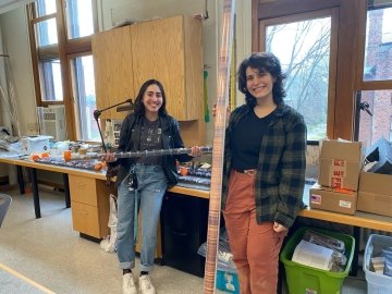 Raquel Aquirre ’22 (on the left) and Monica Geraldes ’22 (on the right) working with cuttings from the test bore hole for the geothermal project.