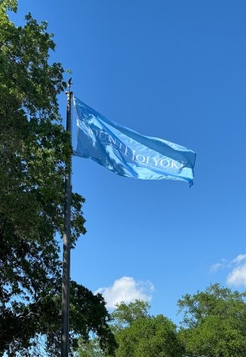 Mount Holyoke College's flag on display at a school in Houston, TX. Photo courtesy of Julie Doyle-Madrid ’98.
