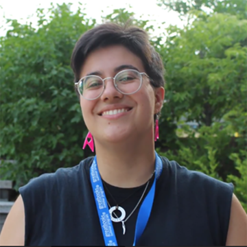 Gina Pasciuto standing outside with trees in the background