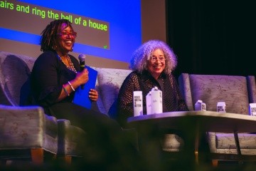 Kijua Sanders McMurtry (left) sits with Angela Y. Davis (right) during the afternoon plenary at BOOM! 2025