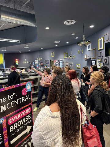 Group of students listen to a guide during a tour.