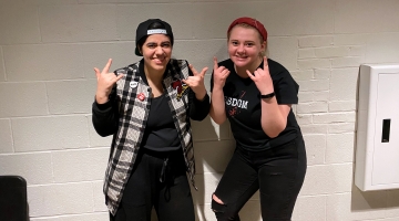 First-year student Gina Pasciuto (left) and sophomore Hannah Dubé (right) take a break from all-day rehearsals for the musical “American Idiot.”  