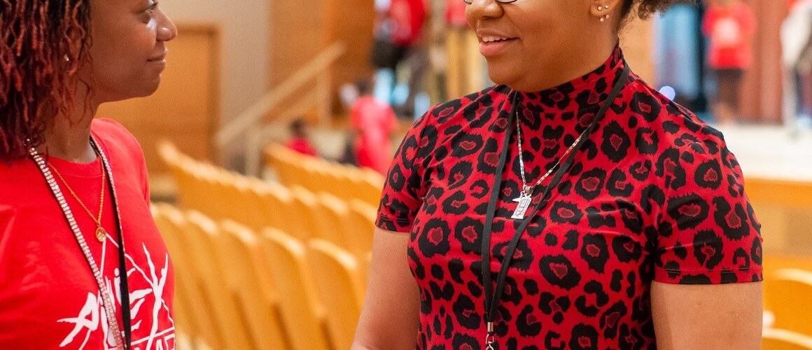 Arsht Center intern Emma Moise ’25 (right) discusses a schedule change with one of the camp directors for AileyCamp Miami. Photo by Justin Namon.