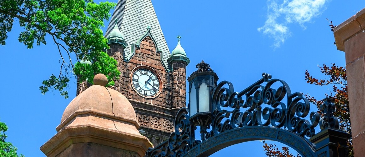 Campus beauty shot of Mount Holyoke's clocktower and gate. Taken in the summer of 2024 by Max Wilhelm.