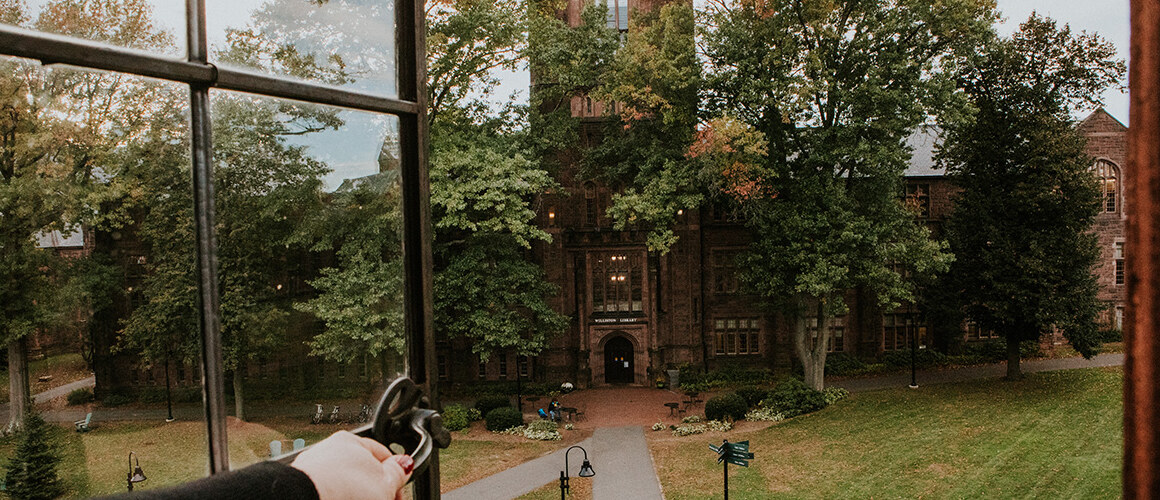 An open window displays an image of the campus library.