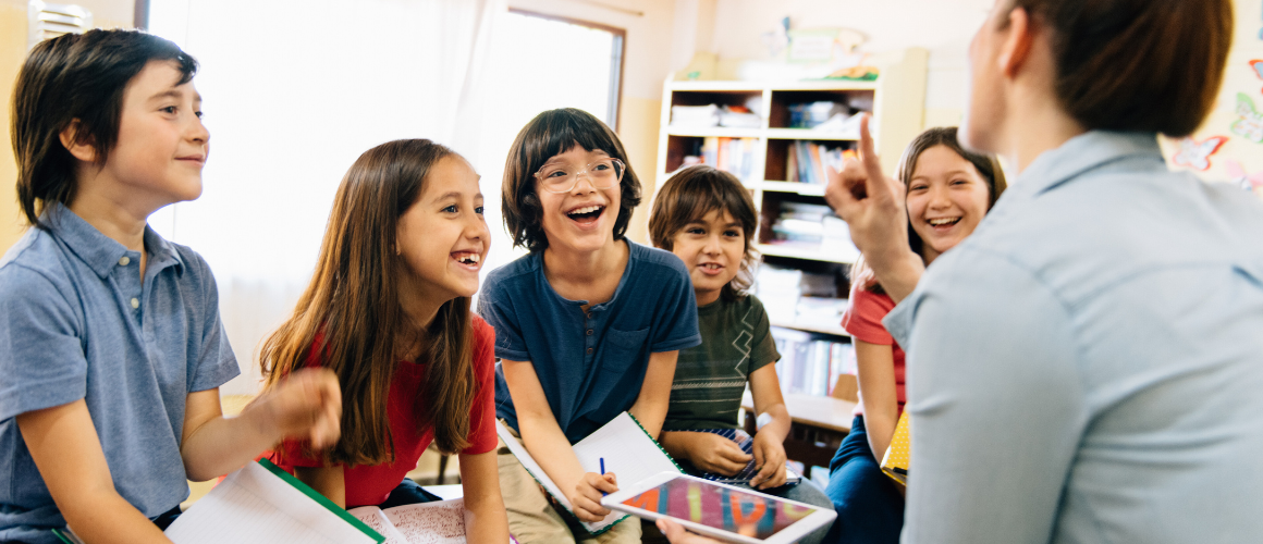 Header for the Choral Counting article. A teacher on the side and kids in the classroom on the left.