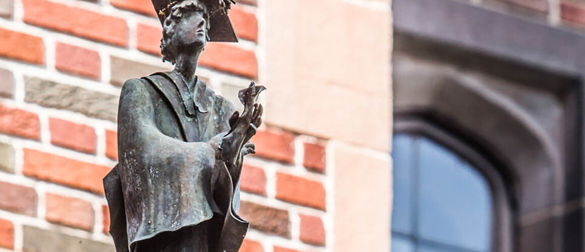 Statue on Mount Holyoke campus of a female scholar