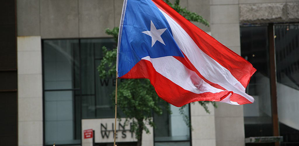The flag of Puerto Rico being waved in a crowd
