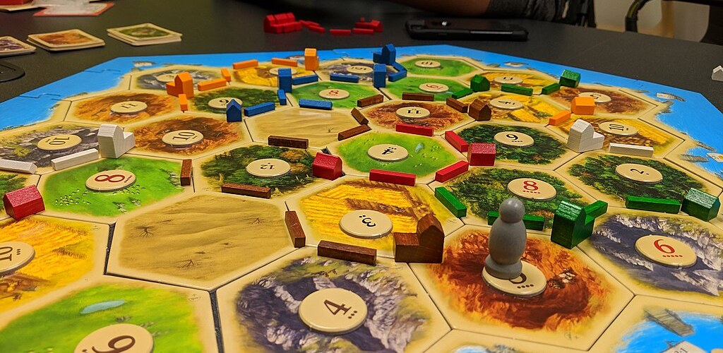 A game of Settlers of Catan. Courtesy of Yongho Kim via Wikimedia Commons.