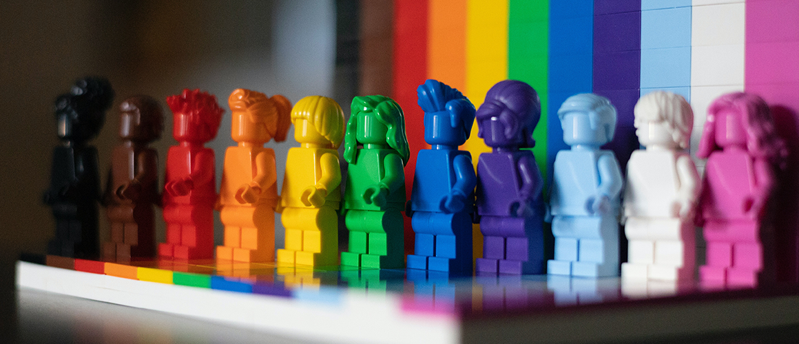 A colorful array of Lego figures arranged in the colors of the rainbow. Photo by James A. Molnar on Unsplash.