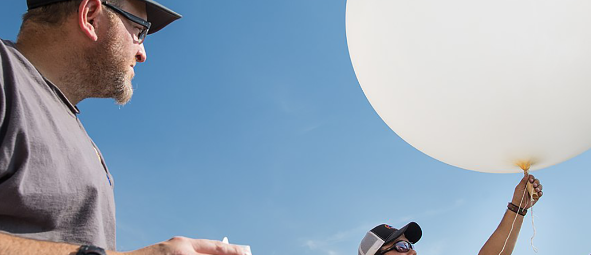 Launching a weather balloon at Mammoth Hot Springs