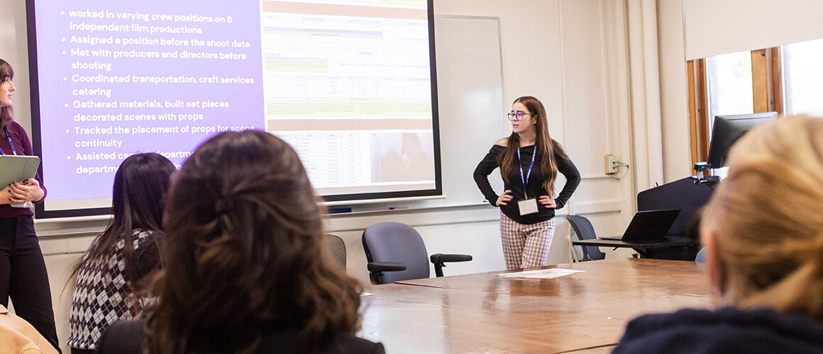 Students presenting in an intimate classrom setting during LEAP Symposium 2022
