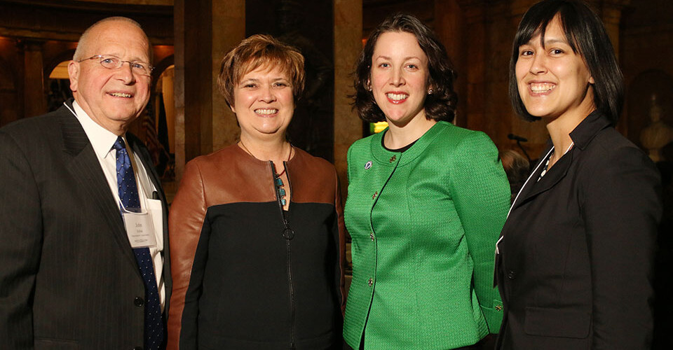 L-R: Representative John Scibak, President Lynn Pasquerella, Senator Kathleen O’Connor Ives ’99 and Becky Wai-Ling Packard.
