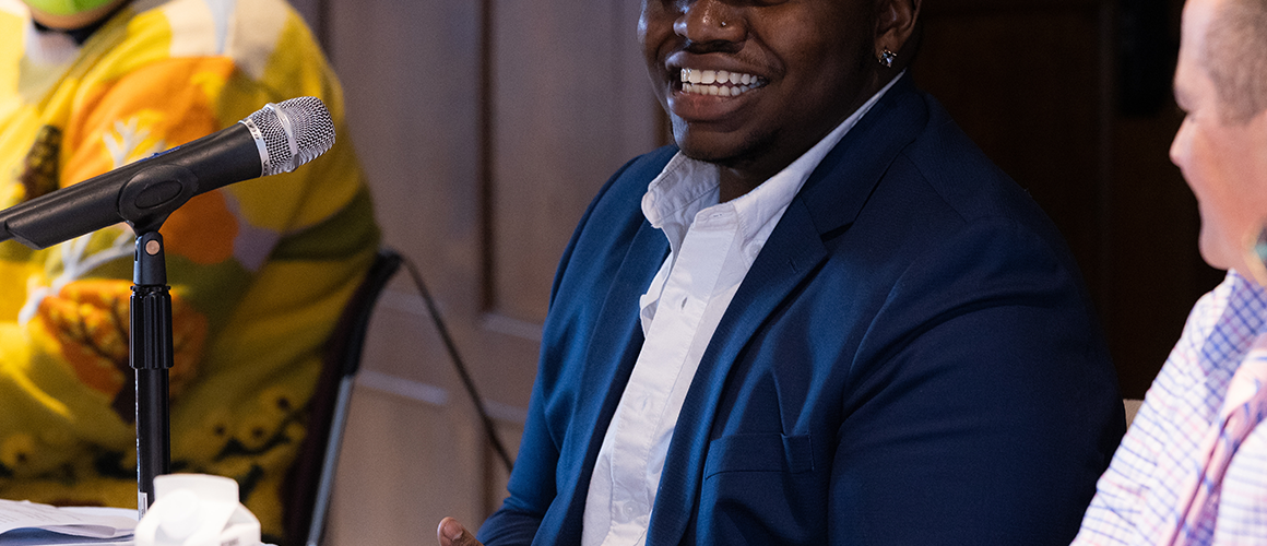 Malakai Chuckas ’20 smiling during a panel discussion at BOOM 2023