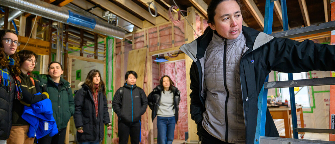 Five College Associate Professor of Sustainable Architecture Naomi Darling (far right) guides Mount Holyoke College students through the renovations of the Phoenix on campus.