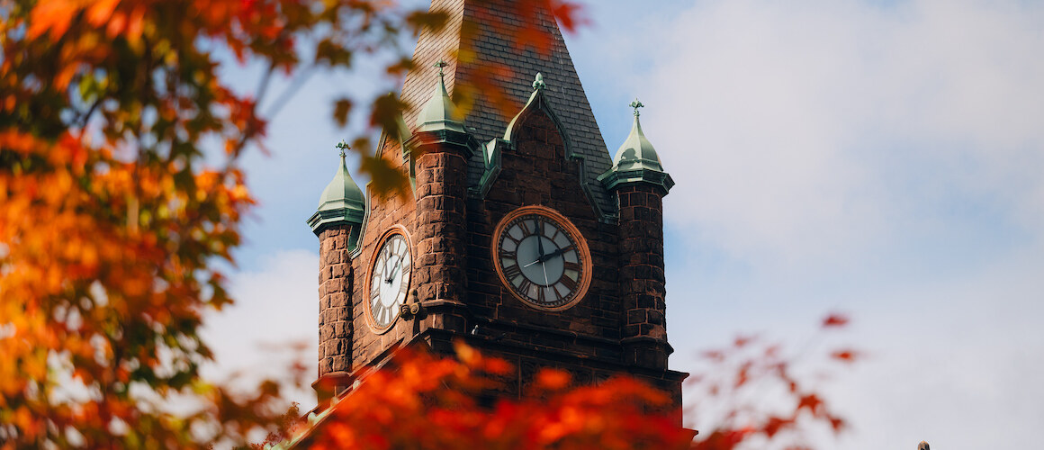 Mount Holyoke College clock tower highlighted by red leaves in the fall of 2024. Photo by Max Wilhelm.