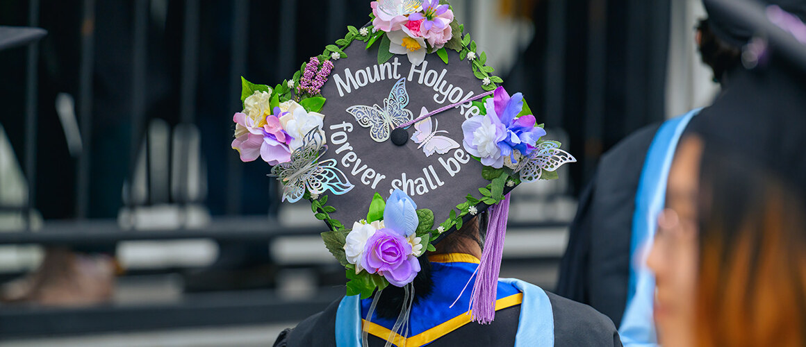 Mount Holyoke student decorated their mortarboard with the words Mount Holyoke Forever Shall Be and flowers