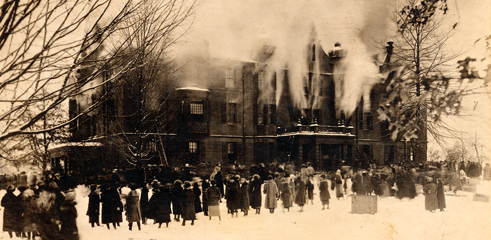 A photograph of the fire at the old Rockefeller Hall on December 21, 1922, while students look on.