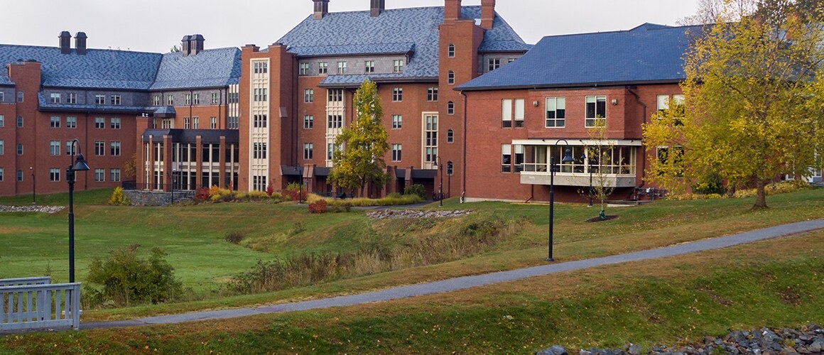 Mount Holyoke College campus in the early fall, where the leaves on the trees are just starting to turn colors.