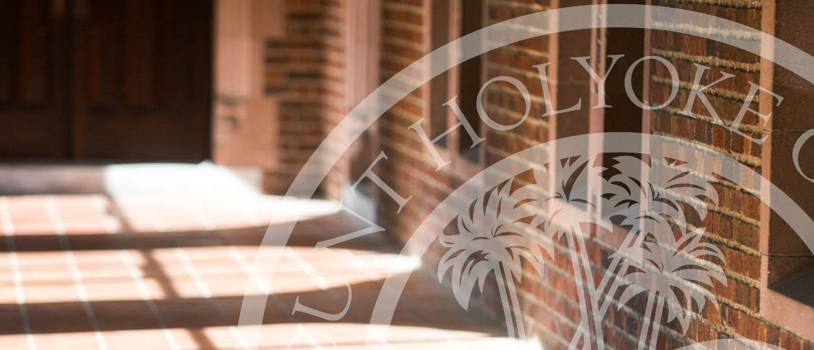 A hallway on the Mount Holyoke campus with the presidential seal overlay