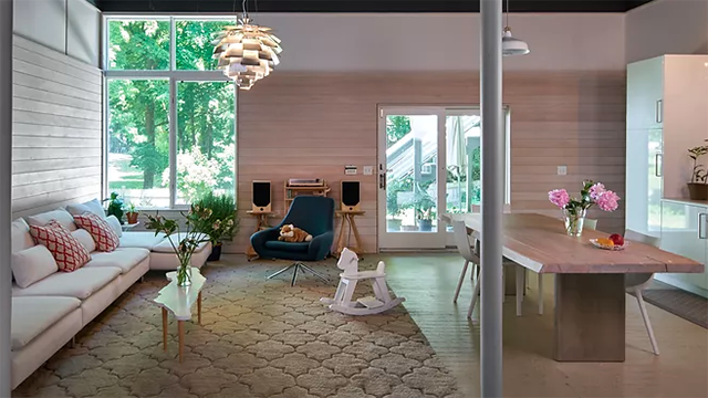 Darling’s redesign of a walkout basement and two-car garage into a spacious mother-in-law loft-style apartment, bathed in natural light and featuring a library with expansive views to lush gardens.