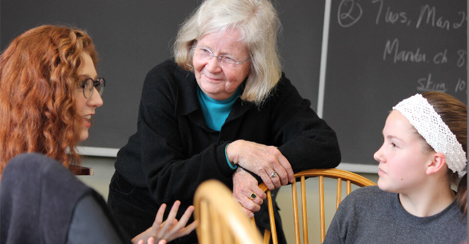 Professor Penny Gill speaks with students in her first-year seminar. Photo by John  Martins
